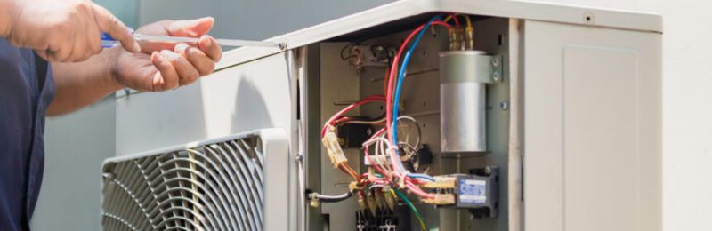Furnace technician repairing a heating system in Lemon Grove CA